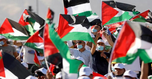 Des manifestants contre le projet d'annexion d'une partie de la Cisjordanie par Israël, à Jéricho, le 22 juin 2020 Des manifestants contre le projet d'annexion d'une partie de la Cisjordanie par Israël, à Jéricho, le 22 juin 2020